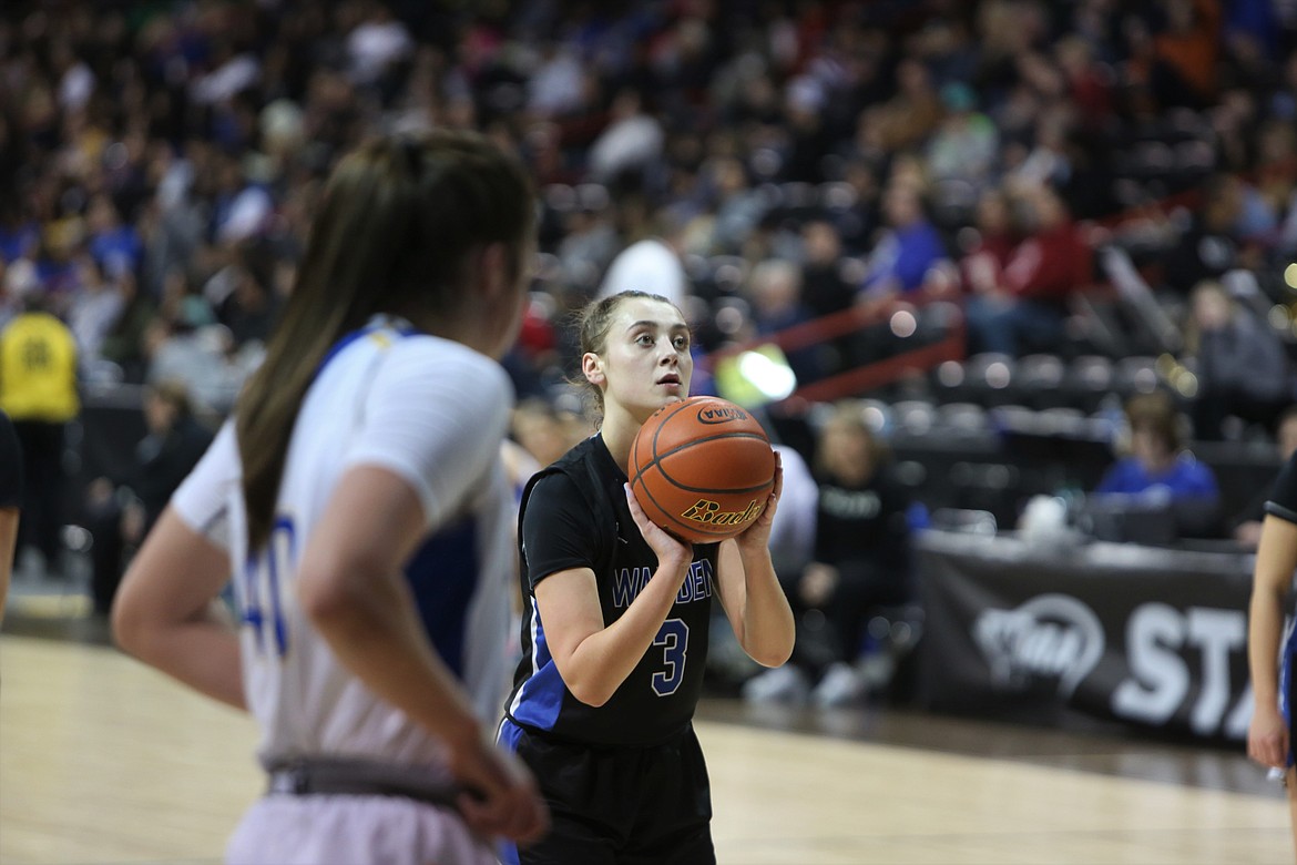 Warden senior Quinn Erdmann attempts a free throw during th third quarter of the Cougars’ state playoff game against Colfax on Friday night in the Spokane Arena.