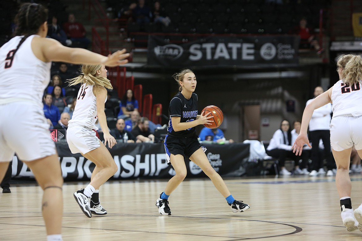 Warden senior Kaylee Erickson, in black, looks for an open teammate during the second quarter against Napavine in the state third/fifth-place game on Saturday.