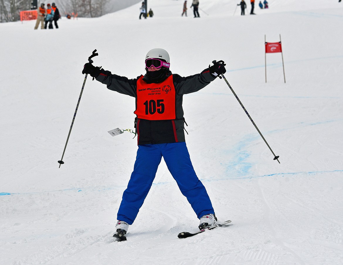 A competitor celebrates finishing the race on the Alpine Giant Slalom course at the Special Olympics Montana Winter Games at Whitefish Mountain Resort on Wednesday, March 1. (Whitney England/Whitefish Pilot)