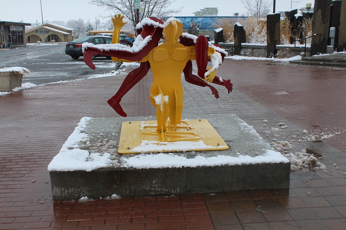 Wrestlers – or at least a statue of wrestlers – fight on through the snow Monday.