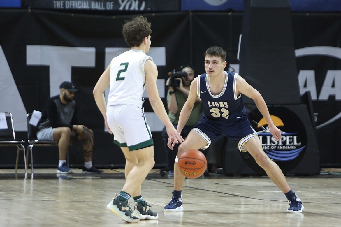 MLCA/CCS freshman Dennis Gulenko defends a DeSales player in the 1B boys state quarterfinals on Thursday.