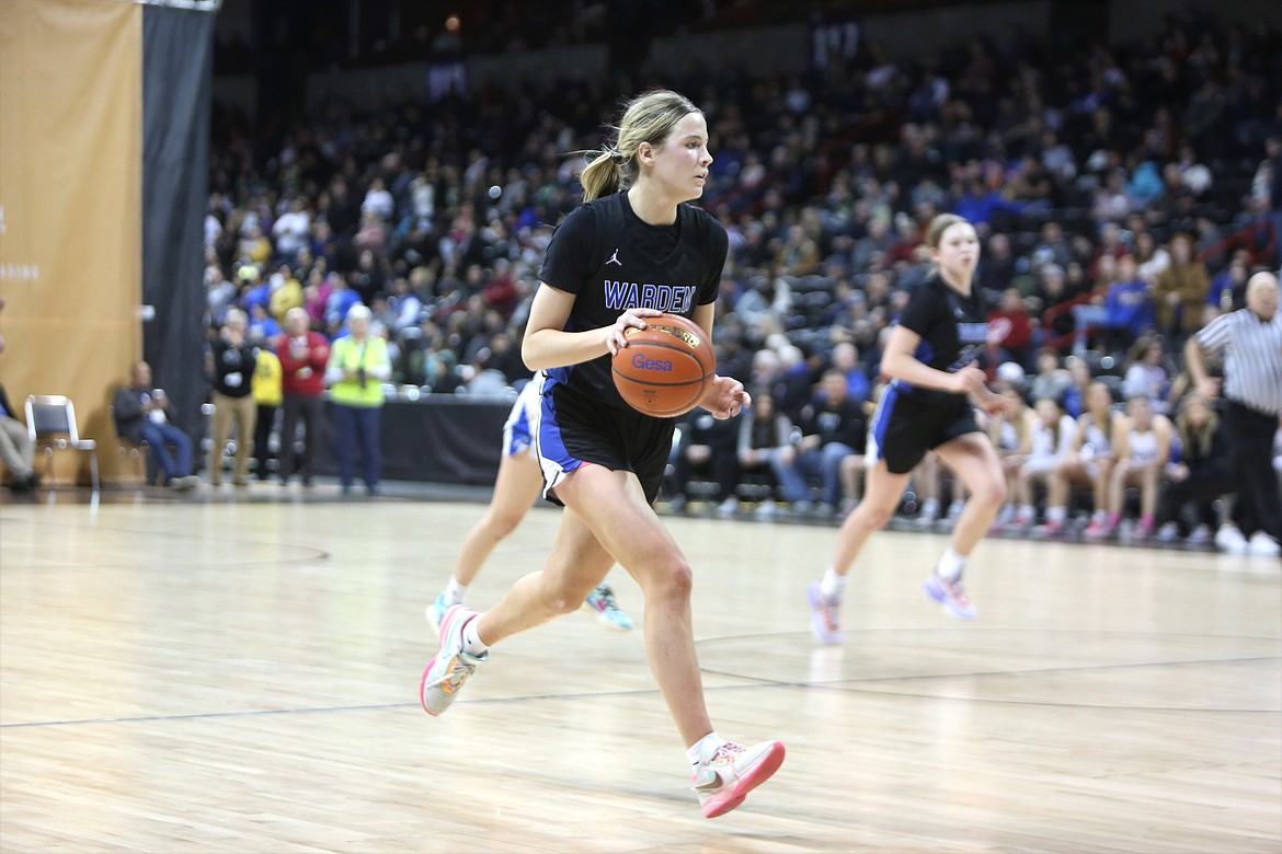 Warden junior Lauryn Madsen brings the ball up the floor against Colfax in the 2B girls state semifinals on Friday.