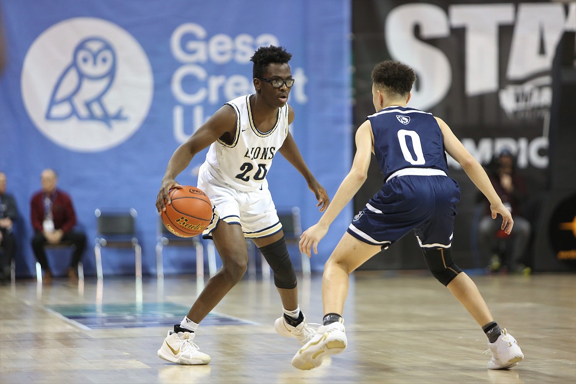 MLCA/CCS senior Jeff Boorman looks for a way to get past a Sound Christian defender in the Lions’ 58-54 win in the 1B boys Round of 12 on Wednesday.