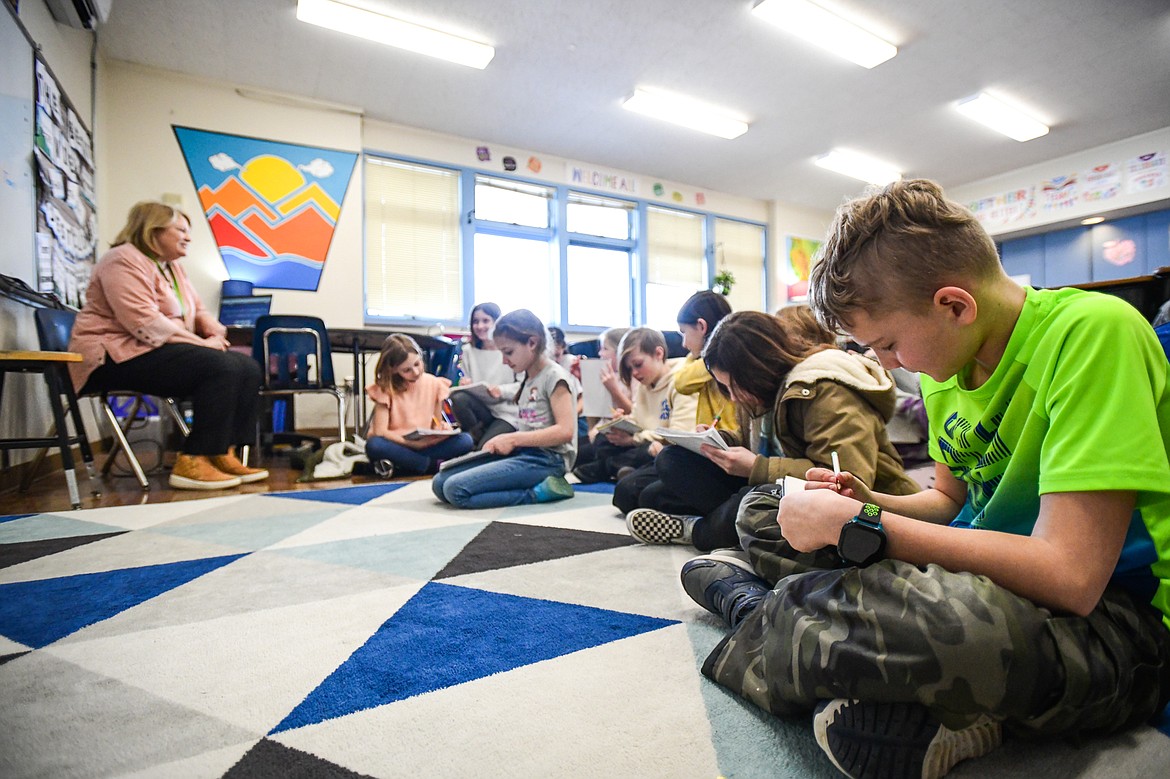 Students participate in a lesson about fact and opinion-based statements in Donna Keel's fourth-grade classroom at Fair-Mont-Egan School on Tuesday, March 7. (Casey Kreider/Daily Inter Lake)