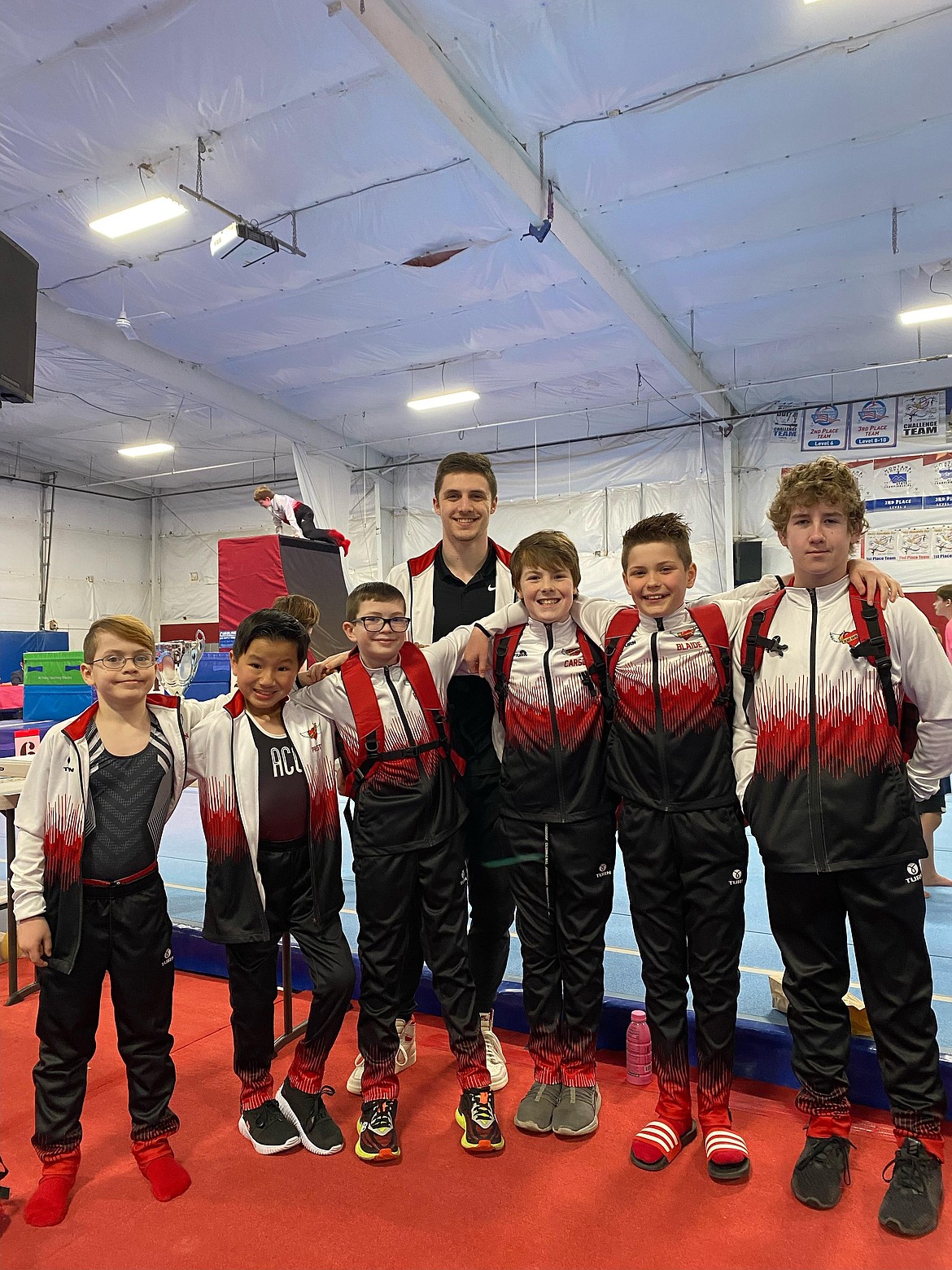 Courtesy photo
Avant Coeur Gymnastics Level 4s and 5s competed at the Tri State Challenge in Missoula, Mont., on Feb. 25. In the front row from left are Paxton Wengeler, Preston Pool, Ray Brown, Carson Kenny, Blaide Cotton and Ricky Parker; and rear, coach Matt Auerbach.