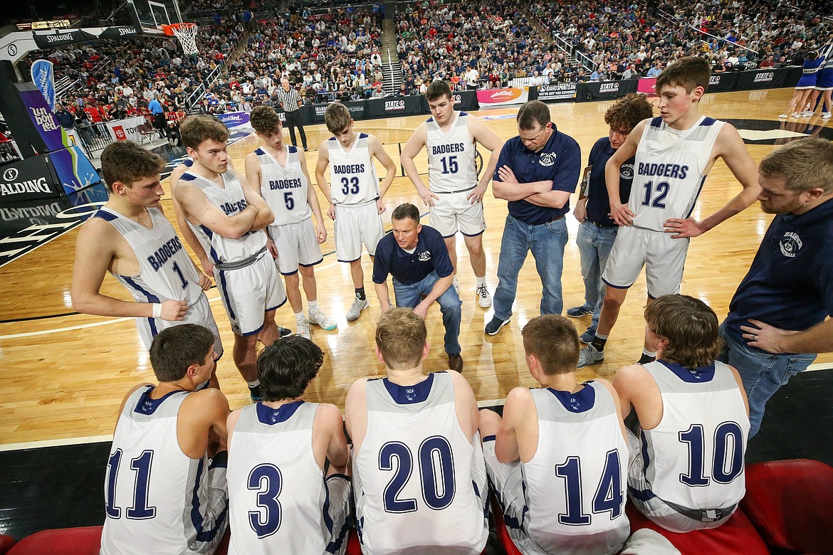 Badgers boys basketball huddle up at the 3A State Championship game on March 4.