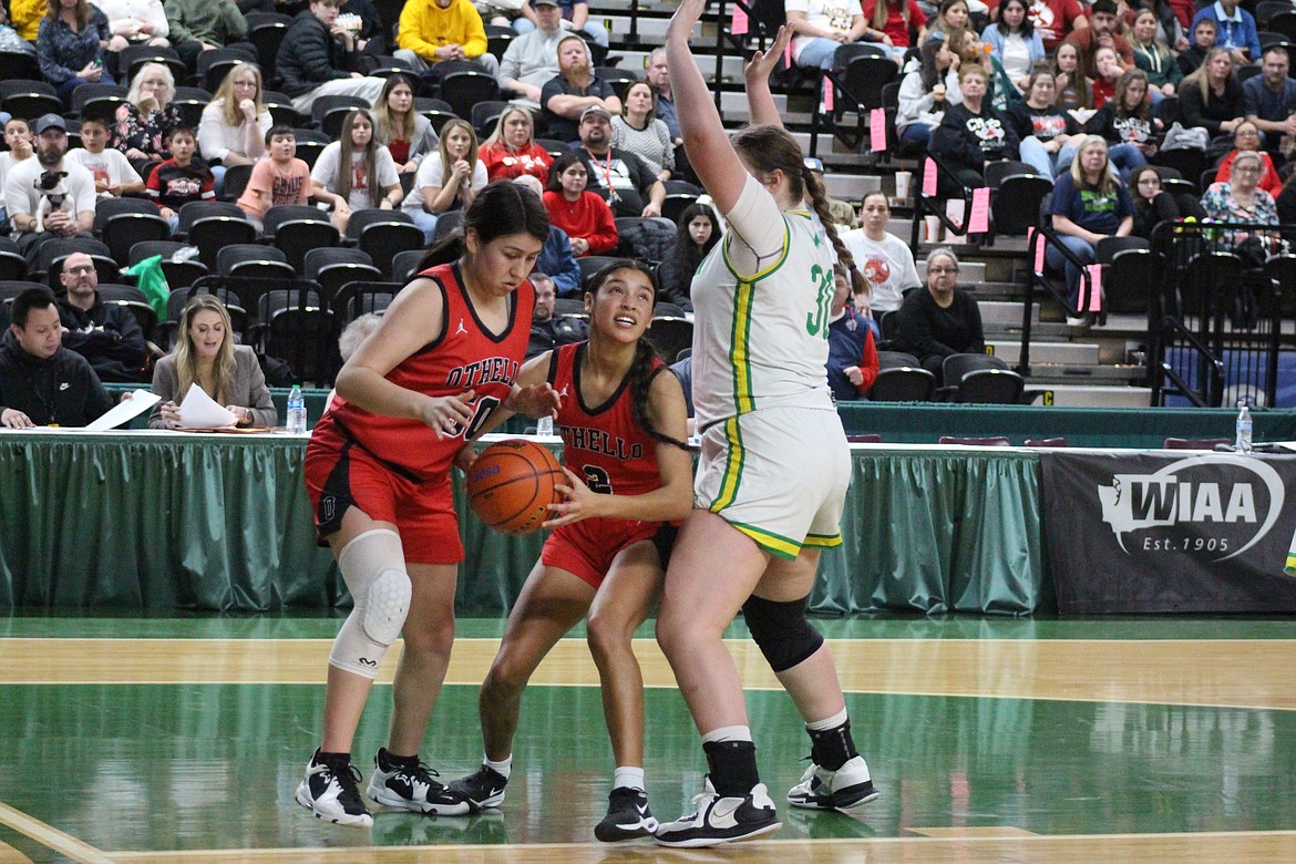 Rubi Mondragon (2) works against the Lynden defense, backed up by Emi Pruneda (50).