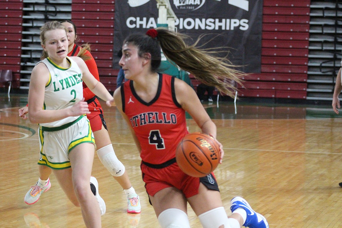 Annalee Coronado (4) drives to the basket in Wednesday’s win over Lynden.