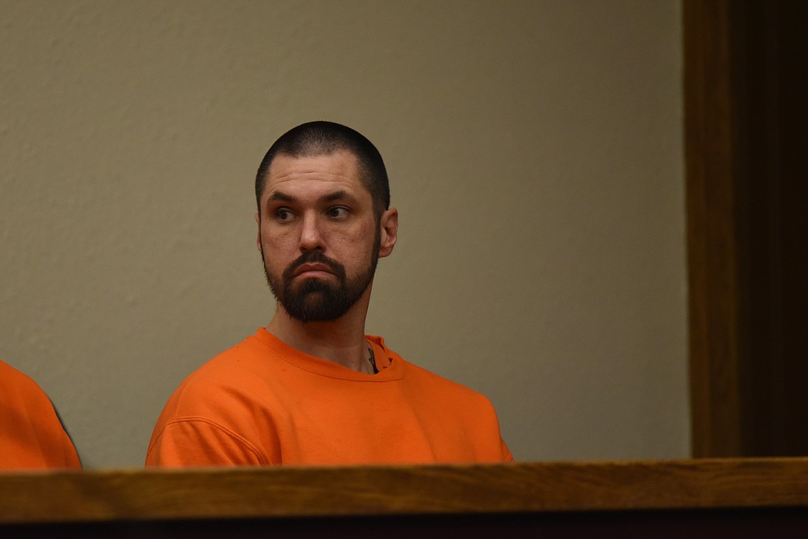 Derrick James Jackson awaits his arraignment on multiple felony counts, including two deliberate homicide charges, in Flathead County District Court on Feb. 22, 2023. (Derrick Perkins/Daily Inter Lake)