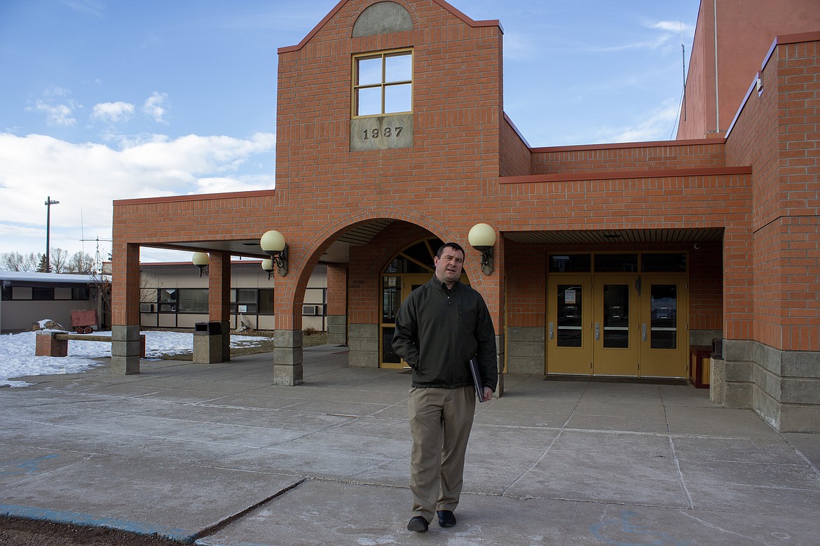 Thomas Gates, principal and superintendent of Philipsburg Public Schools in Montana, stands outside a building in which half the faucets revealed high enough levels of lead that the district had to repair or turn off the fixtures. (Katheryn Houghton/KHN)