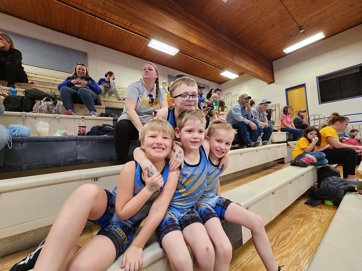 Libby Wrestling Club's Wesley Ebey, Ruban Covey, Jaxon Ames and Ryder Rebo enjoy a break in the action last weekend.