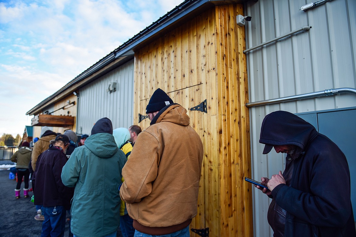People stand in line outside the Flathead Warming Center in Kalispell on Tuesday, March 7. (Casey Kreider/Daily Inter Lake)