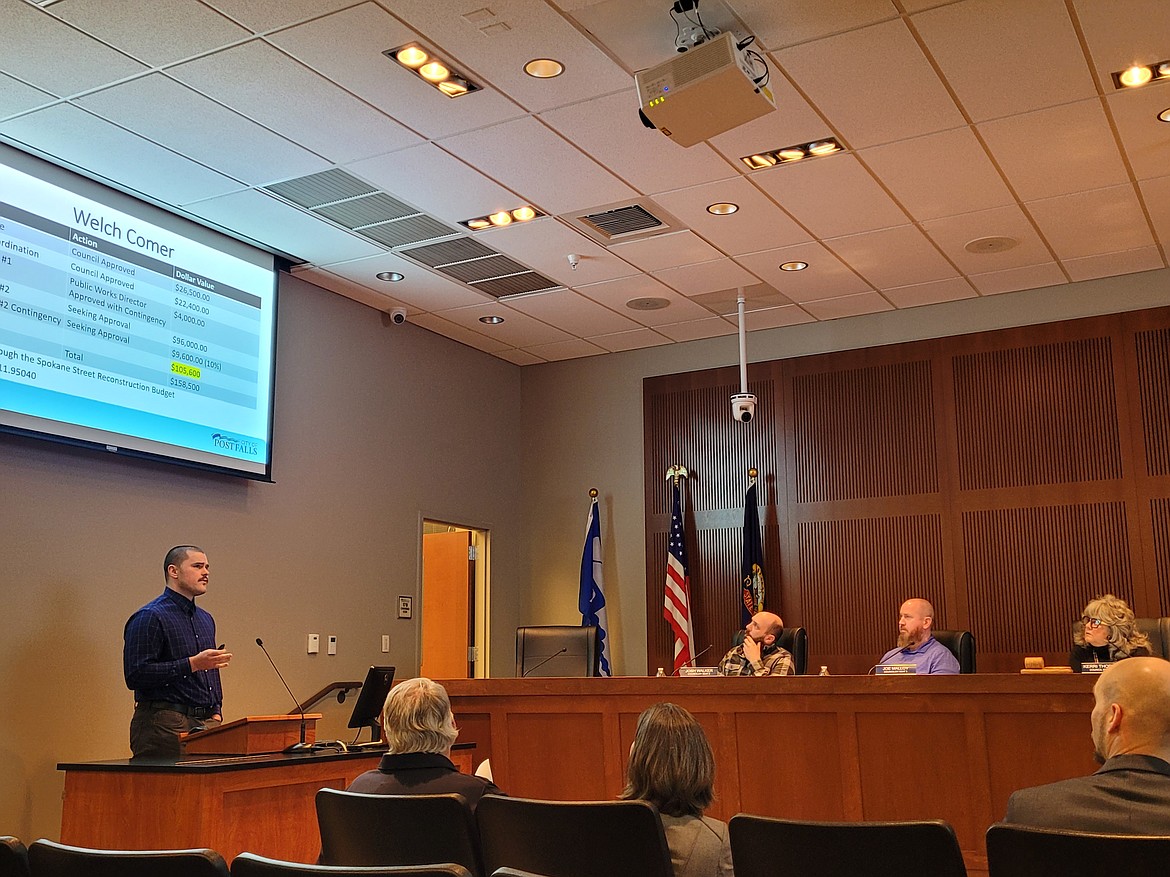 Post Falls Public Works project manager Jaxon Fleshman presents information about the Spokane Street Rehabilitation project Tuesday evening during the Post Falls City Council meeting.