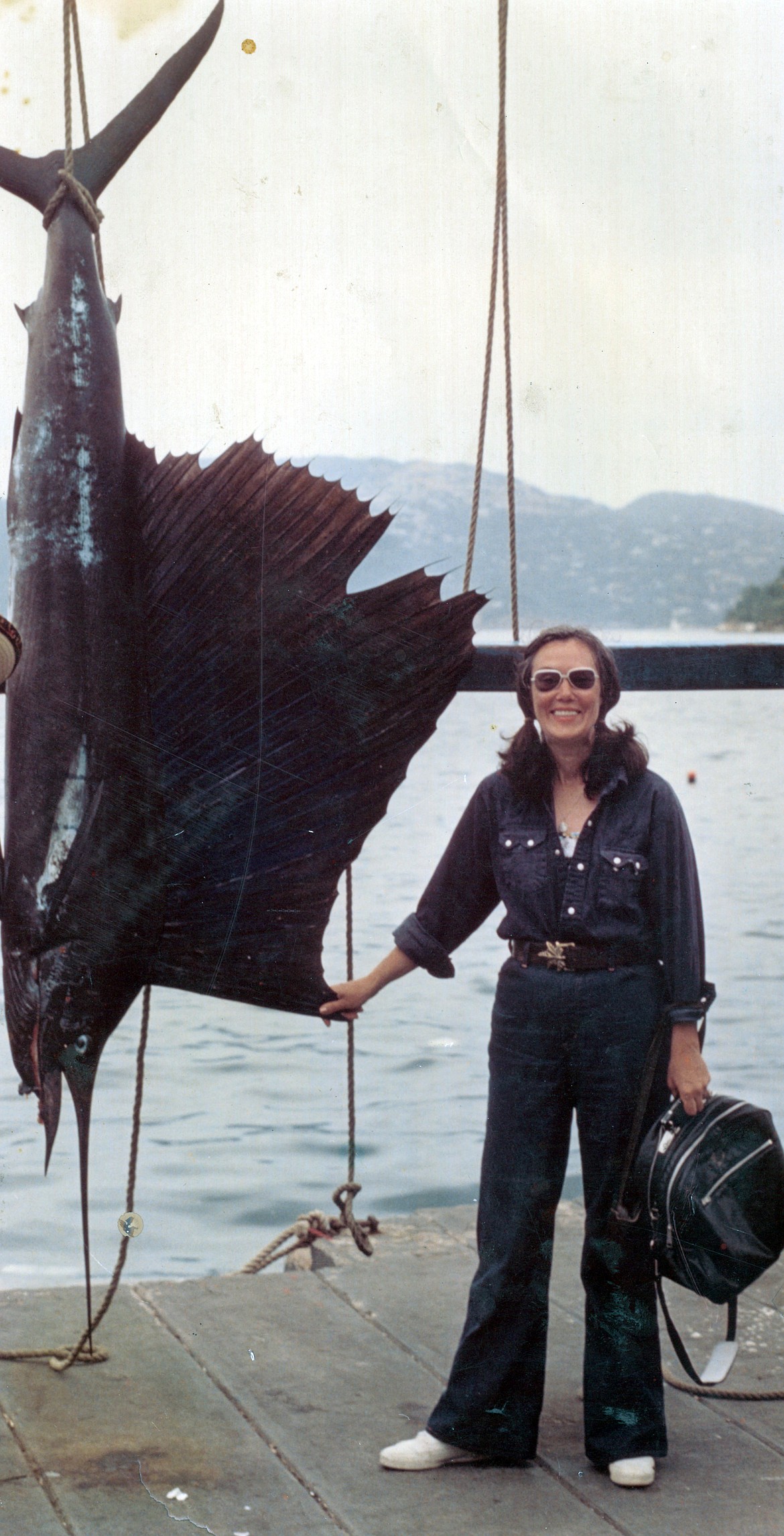 Valle Novak is pictured with a 10-foot sailfish she caught in Acapulco in 1974. "Did it all by myself," she wrote on the back of the photograph.
