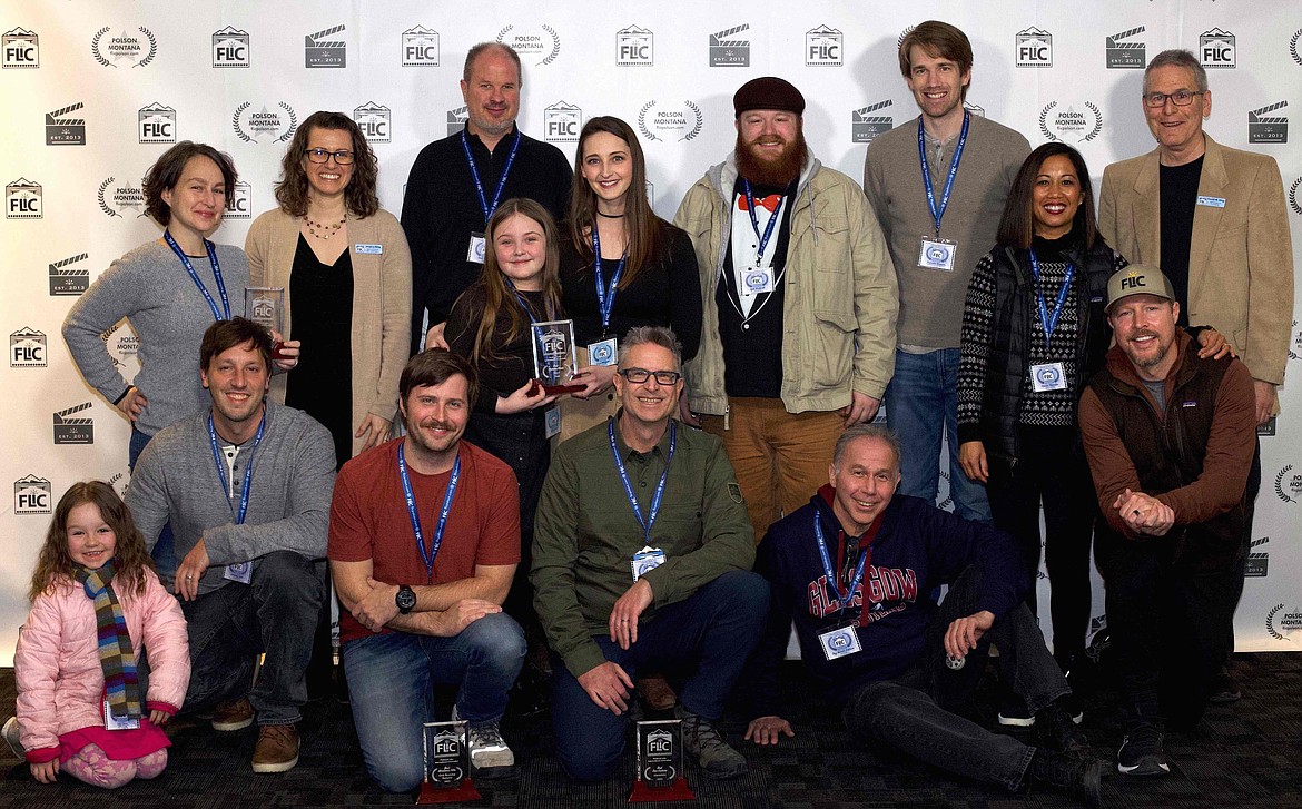 Filmmakers and organizers of the festival gather at the Flathead Lake International Cinemafest, top row left to right, Abby Berendt Lavoi, FLIC Producer Jessica King, Scott Sterling, Zuzu Weingart with her daughter Lily, Kyle Beckwith, Brandon Gaesser, Denise Thornton, with husband Matthew, and FLIC Director David W. King. In front from left,  Lilly Lavoi with her father Jeremey Lavoi, Andrew Labens, Kelly Gorham, and Ray Nomoto Robison. (Photo courtesy of Alex Kowalchik, Vladi Media)