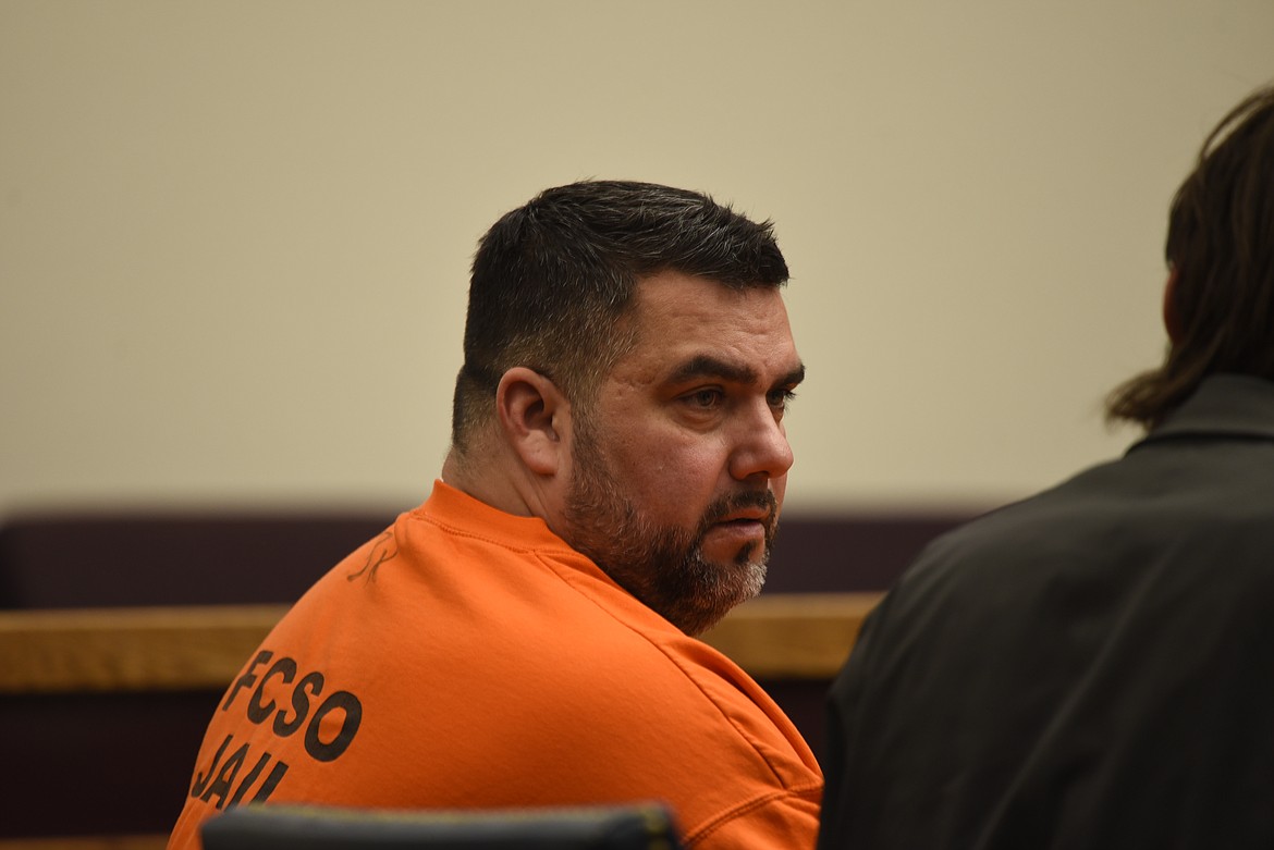 Michael Allan Murphy, 49, appears in Flathead County District Court for his arraignment on a felony charge of issuing a bad check. (Derrick Perkins/Daily Inter Lake)