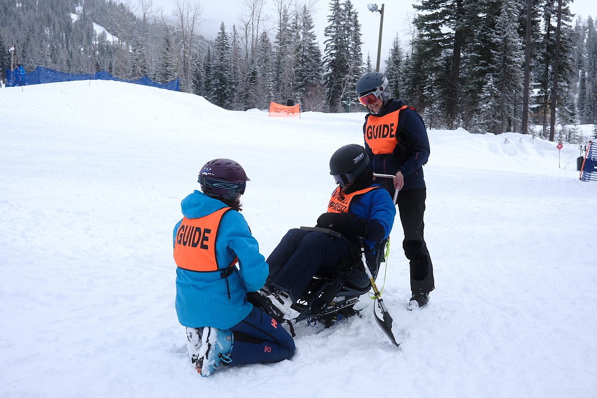Army veteran Yoneka Trent tries out an adaptive sit ski with the help of DREAM adaptive coaches at Whitefish Mountain Resort on Tuesday, Feb. 28, 2023. (Adrian Knowler/Daily Inter Lake)