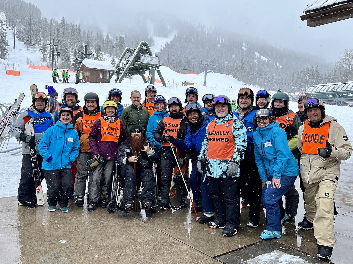 Members of the Blinded Veterans' Association pose for a photo with volunteers from DREAM Adaptive Recreation and the Whitefish Veterans Support Team at Whitefish Mountain Resort on Tuesday, Feb. 28, 2023. (Photo courtesy of DREAM adaptive)