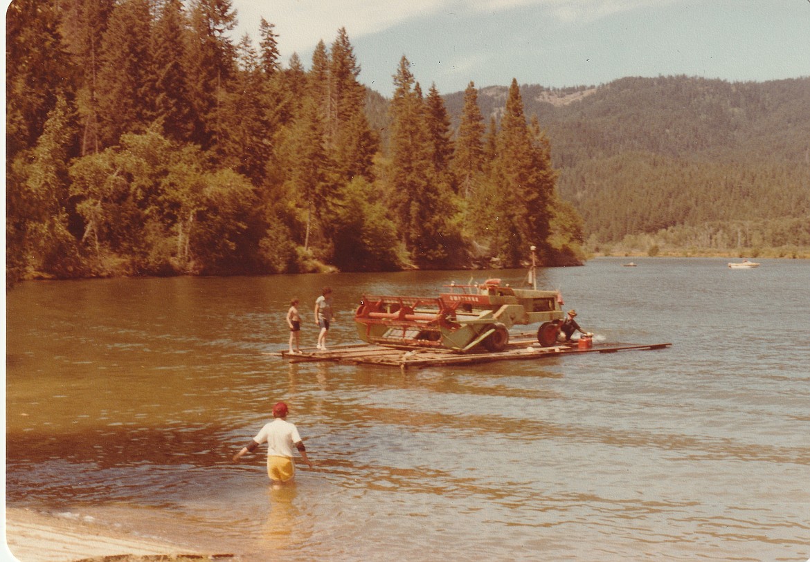 The 1955 John Deere combine went across the river with few issues in the summer of 1982, as the farming couple created their own raft out from an old dock and barrels.