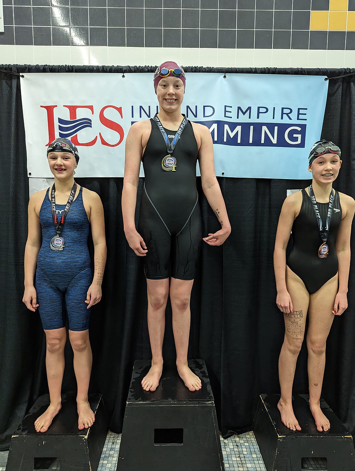 Myelle Jensen, far left, is pictured on the podium at the Inland Empire Short Course Championships at the University of Idaho this past weekend.