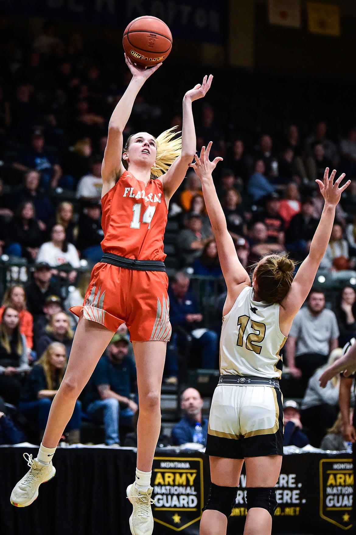 Flathead's Kennedy Moore (14) shoots over Billings West's Maria Ackerman (12) in the first half of the girls' Class AA state basketball championship at the Butte Civic Center on Saturday, March 11. (Casey Kreider/Daily Inter Lake)