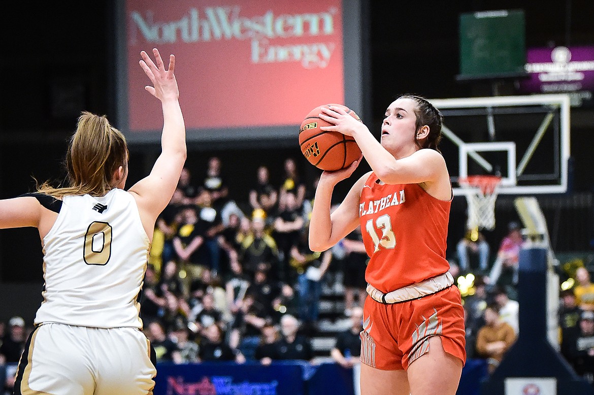 Flathead's Avery Chouinard (13) knocks down a three against Billings West in the second half of the girls' Class AA state basketball championship at the Butte Civic Center on Saturday, March 11. (Casey Kreider/Daily Inter Lake)