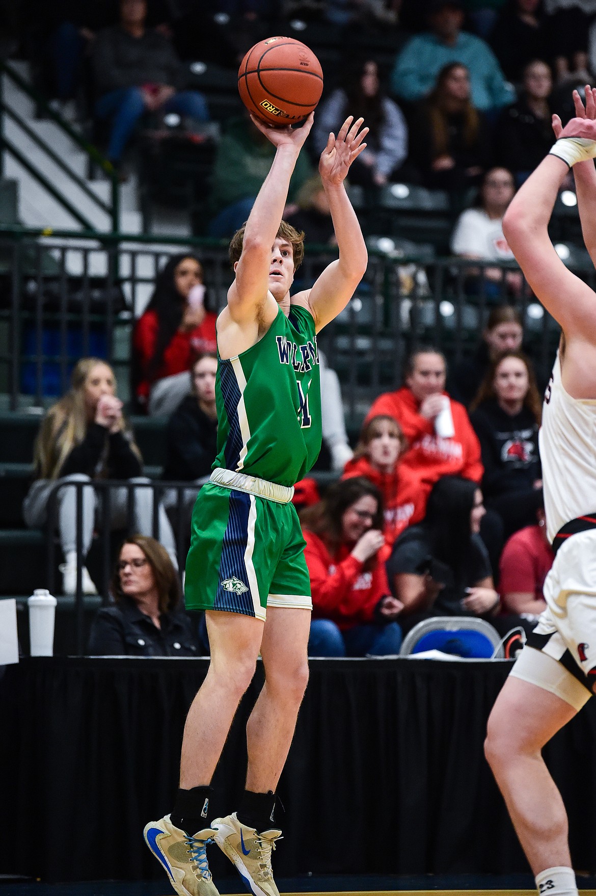 Glacier's Xavier Stout (11) sinks a three in the first half of the third-place game at the Class AA state basketball tournament at the Butte Civic Center on Saturday, March 11. (Casey Kreider/Daily Inter Lake)