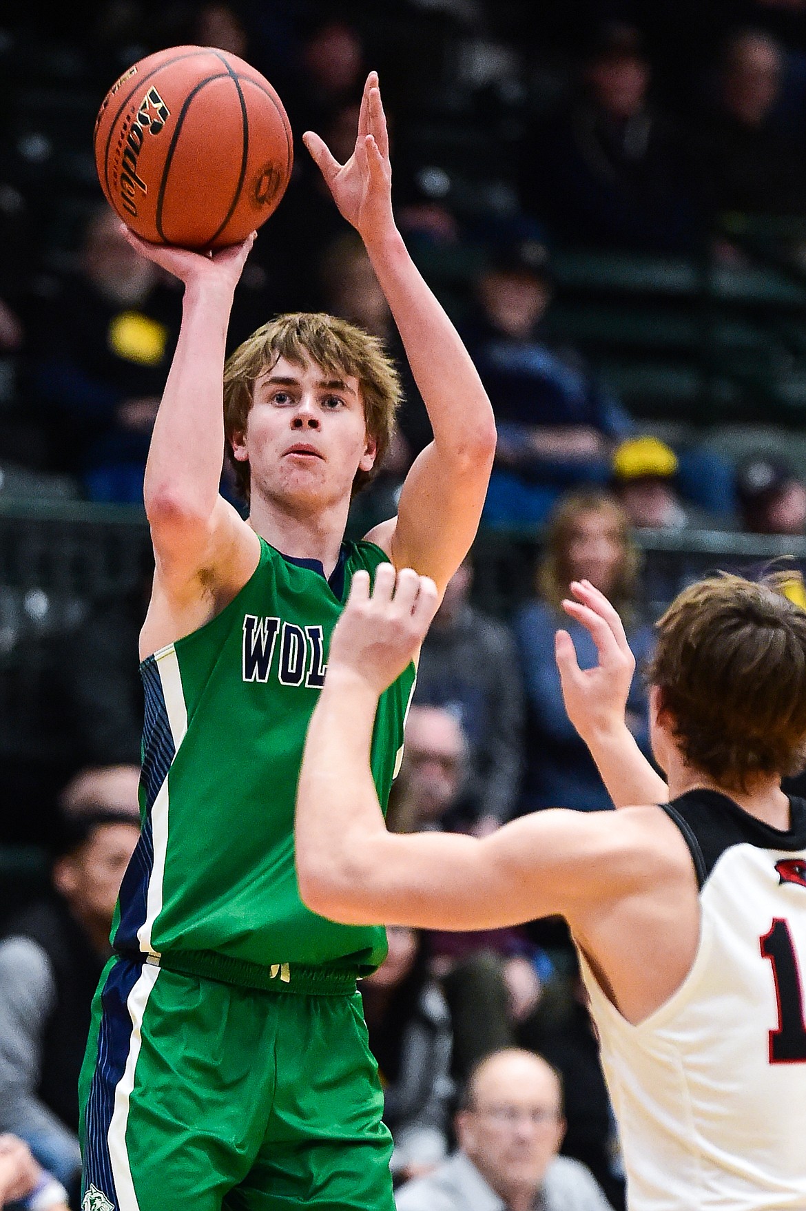 Glacier's Tyler McDonald (2) knocks down a three in the first half of the third-place game at the Class AA state basketball tournament at the Butte Civic Center on Saturday, March 11. (Casey Kreider/Daily Inter Lake)