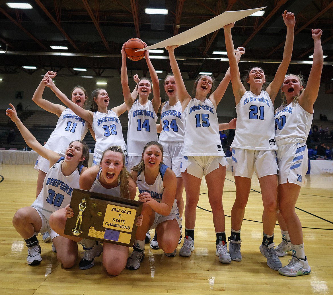 The Bigfork Valkyries celebrate their first-ever basketball state title after downing Big Timber 49-37 in the State B Tournament in Great Falls on Saturday, March 11. (Jeremy Weber/Daily Inter Lake)