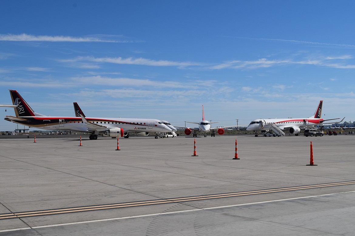 Four of Mitsubishi Aircraft’s SpaceJets — initially known as the MRJ, or Mitsubishi Regional Jet — parked on the ramp of the Grant County International Airport in May 2020 during the test flight of MagniX’s all-electric Cessna Caravan. In early February, Mitsubishi Aircraft parent company Mitsubishi Heavy Industries announced it was ending development of the SpaceJet, citing both the complexity of the program and its cost.