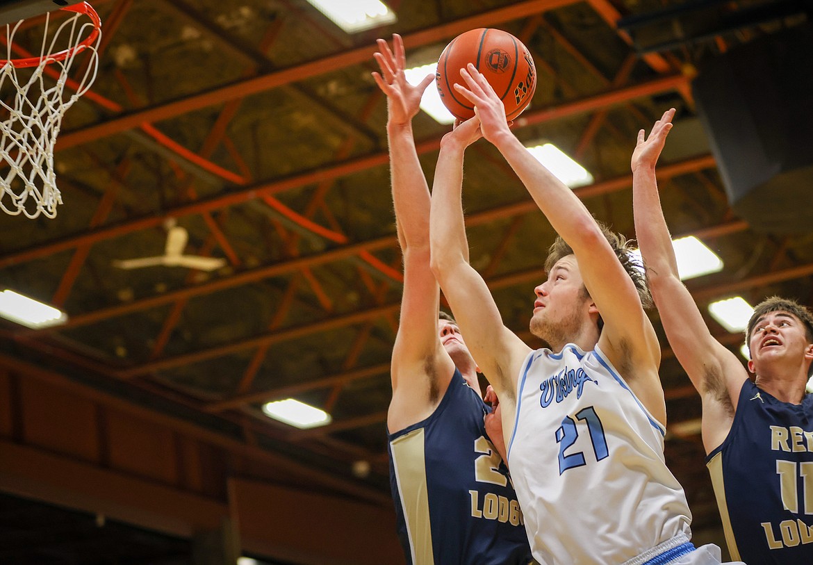 Bigfork’s Isak Epperly rises above the Red Lodge defense for two of his 14 points in the consolation final of the State B Basketball Tournament in Great Falls on Saturday, March 11. (Jeremy Weber/Daily Inter Lake)