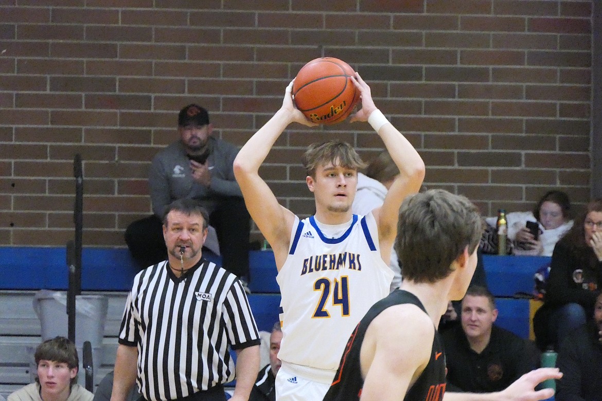 Class B All-State selection senior Jesse Claridge (24) looks for an open teammate during an in-bounds play earlier this year.  Claridge, in addition to being chosen All-State, was also named first team 7B All-Conference. (Chuck Bandel/VP-MI)