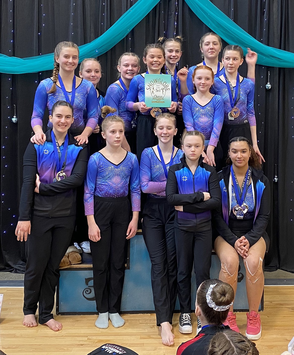 Courtesy photo
Some other members of the GEMS Athletic Center gold gymnastics team at the Snowglobe Classic last weekend in Post Falls. In the front row from left are Ariel Fahey, Macee Caudle, Fynlie Reynolds, Sydney Burke and Shariece Vandver; and back row from left, Makenna Hillman, Arie Ferguson, Kaylin Maloney, Kinsley Bodman, Saydee Mathews, Elleah Hubbard, Laina Busicchia and Allie Netzel.