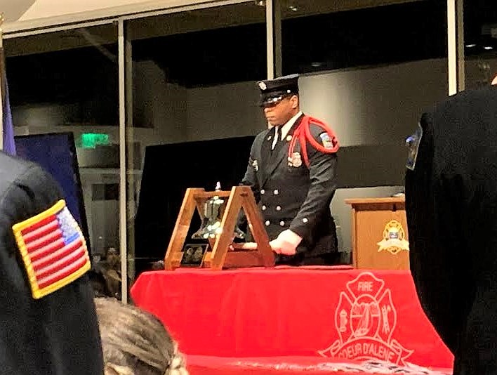 Engineer Josh Hoston rings the bell during the Coeur d'Alene Fire Department's awards banquet Saturday at the Hagadone Event Center.