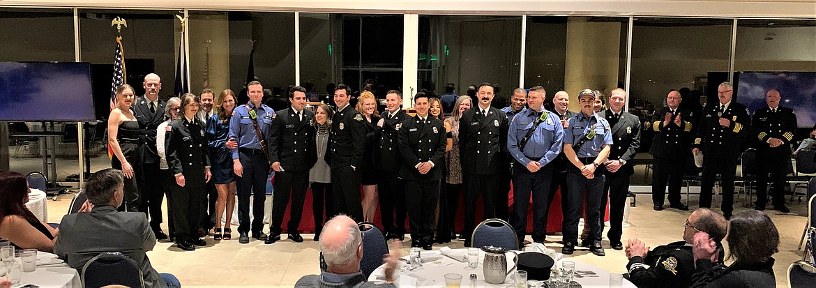 Firefighters, family and friends gather during one of the pinning ceremonies during the Coeur d'Alene Fire Department's annual awards banquet at the Hagadone Event Center.