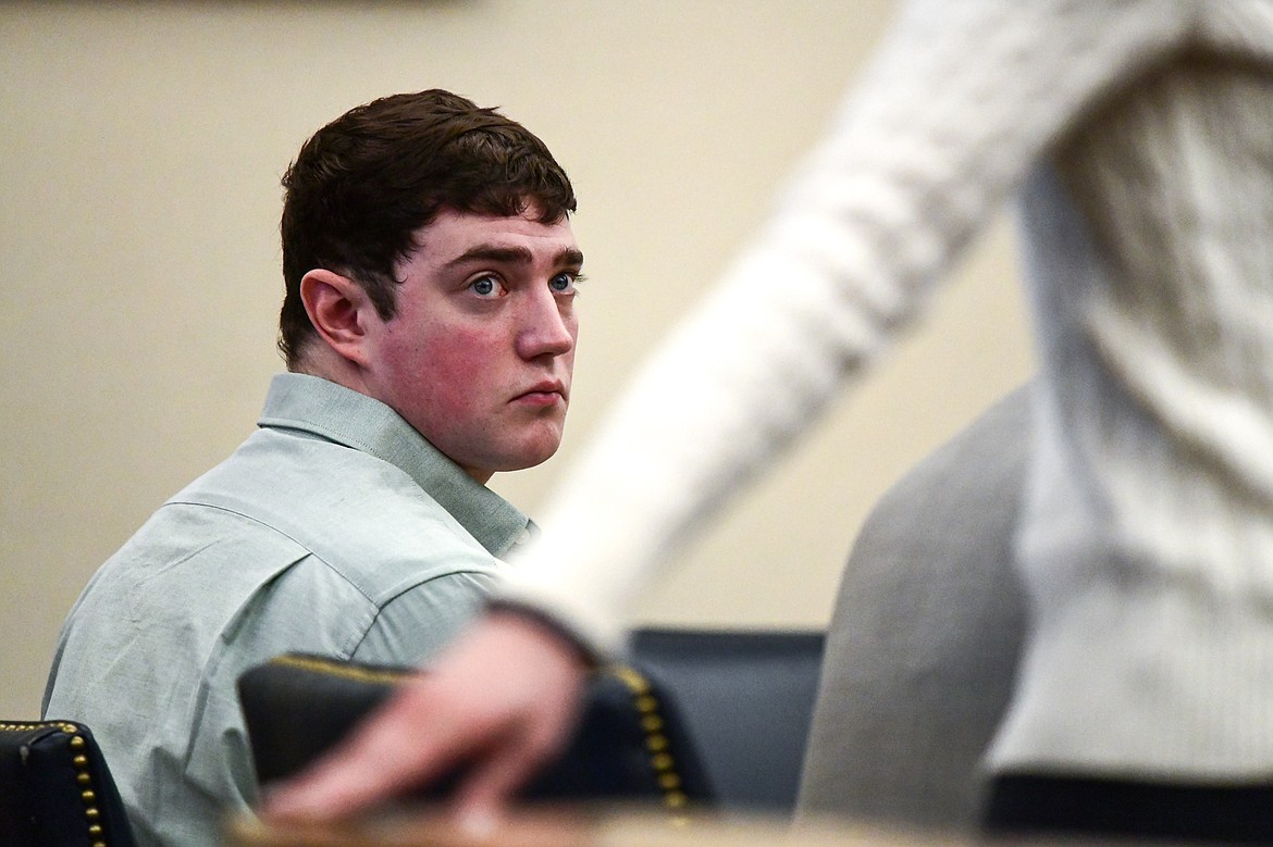Zackary Matthew Maas watches as his fiance Anna Kirchner takes the stand during his deliberate homicide trial in Flathead County District Court on Tuesday, March 14. (Casey Kreider/Daily Inter Lake)