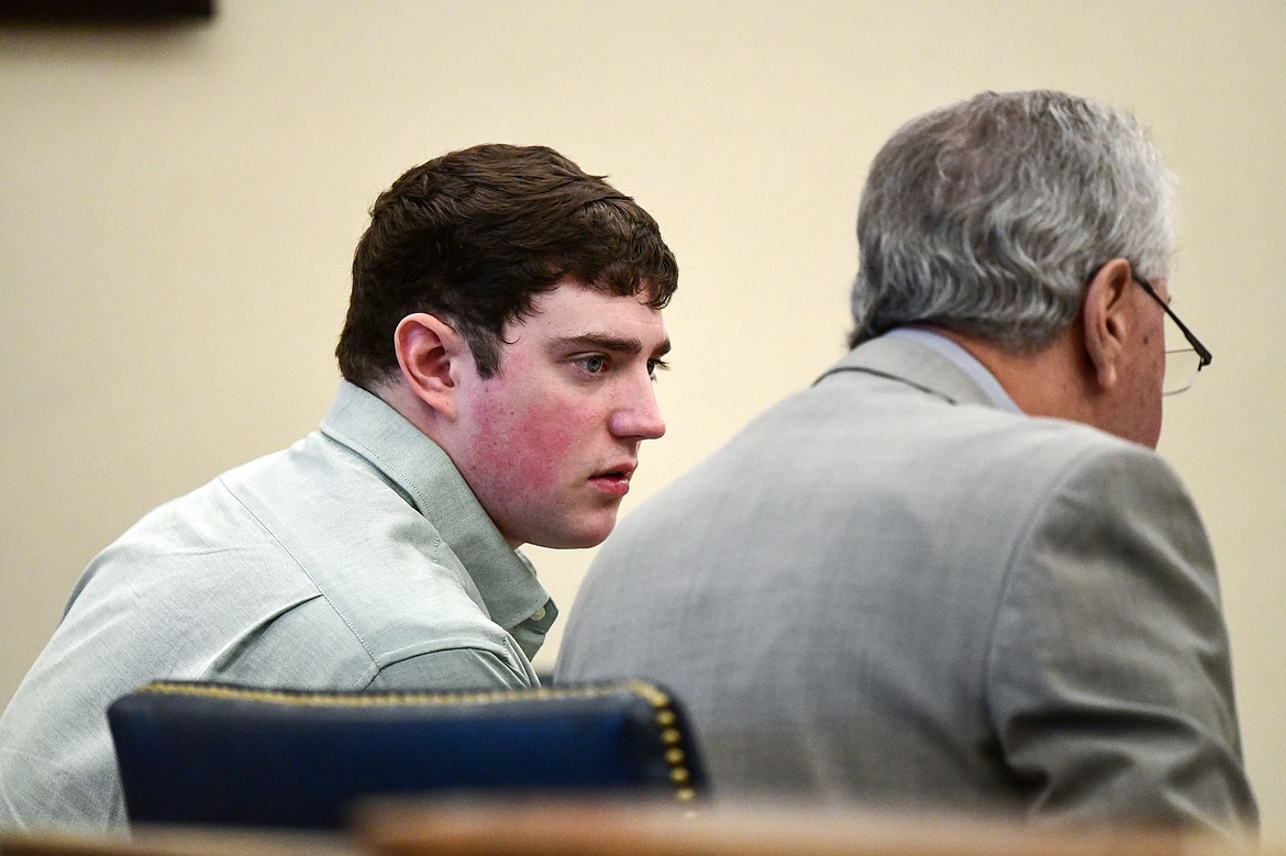 Zackary Matthew Maas speaks with his attorney, Stephen Nardi, during his deliberate homicide trial in Flathead County District Court on Tuesday, March 14. (Casey Kreider/Daily Inter Lake)