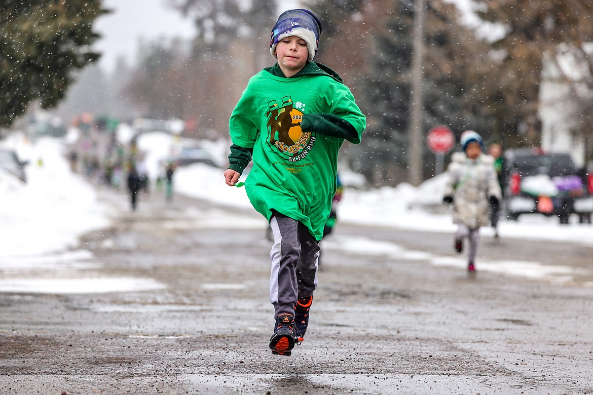 A youngster participates in the Fun Run at Cloverfest on Saturday. (JP Edge photo)