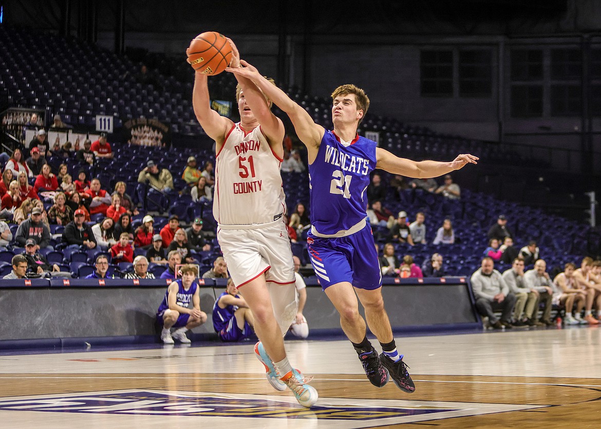 Senior Bryce Dunham swats at the ball at State in Bozeman. (JP Edge photo)