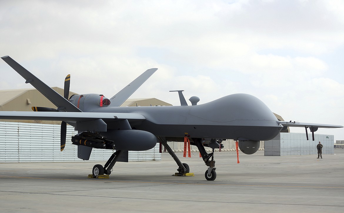 A U.S. MQ-9 drone is on display during an air show at Kandahar Airfield, Afghanistan, Tuesday, Jan. 23, 2018. A Russian fighter jet Tuesday, Marc 14, 2023, struck the propeller of a U.S. MQ-9 drone surveillance drone over the Black Sea, causing American forces to bring down the unmanned aerial vehicle in international waters, the U.S. military said, an incident that highlighted soaring U.S.-Russian tensions over Moscow's war in Ukraine. (AP Photo/Massoud Hossaini, File)