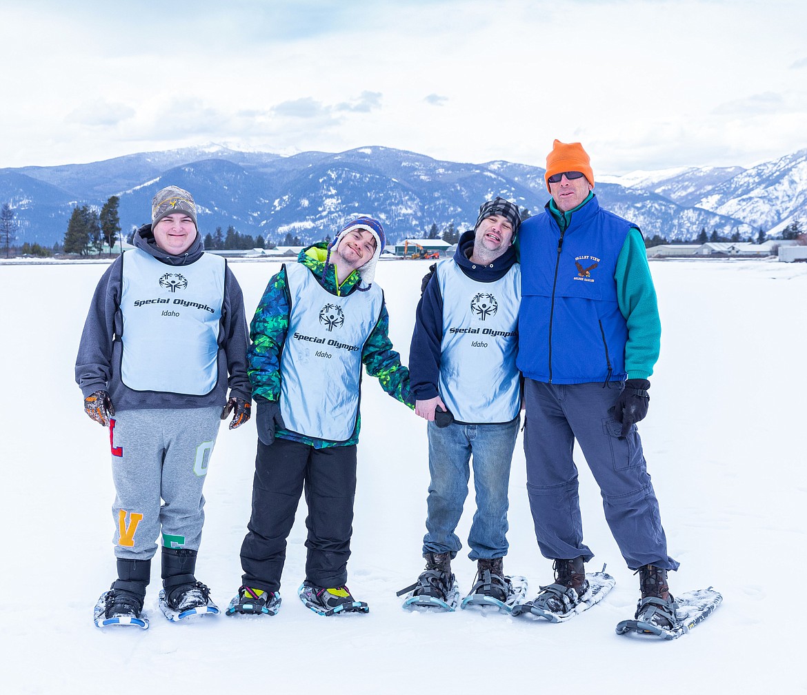 The Bonners Ferry Special Olympics snowshoeing team. From left: Athletes Ladonna Gaston, Gavin Lee and Michael Bjoraker along with Coach John Beck.