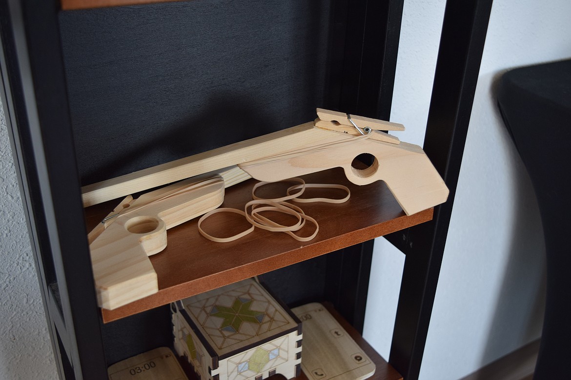 A brace of wooden rubber-band pistols made and sold by A Plus Woodshop in downtown Moses Lake. The rubber band guns are top sellers for A Plus, according to shop owner Samantha Simmonds.