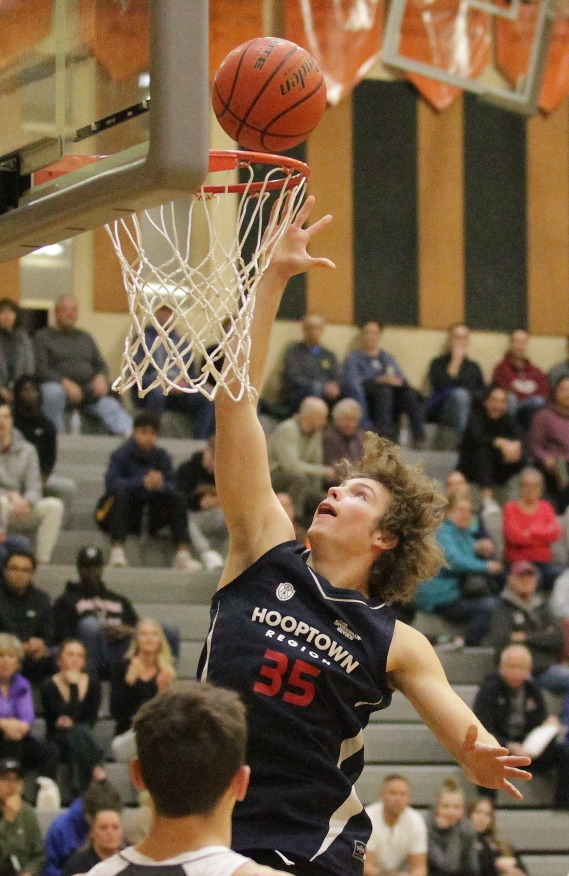 MARK NELKE/Press
Alexander Nipp (Coeur d'Alene High) of the Region team tips in a shot during the Denny Humphrey Memorial boys high school all-star basketball game Tuesday night at Lewis and Clark High in Spokane.