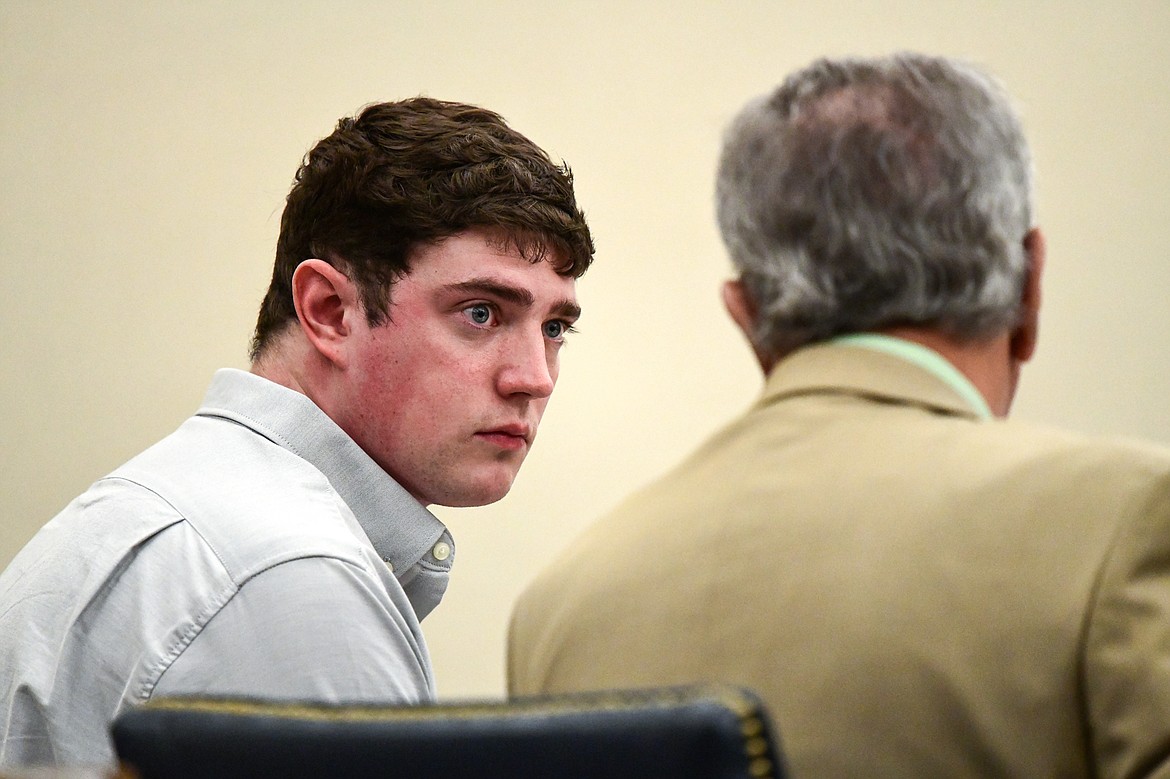 Zackary Matthew Maas speaks with his attorney, Stephen Nardi, during his deliberate homicide trial in Flathead County District Court on Wednesday, March 15. (Casey Kreider/Daily Inter Lake)