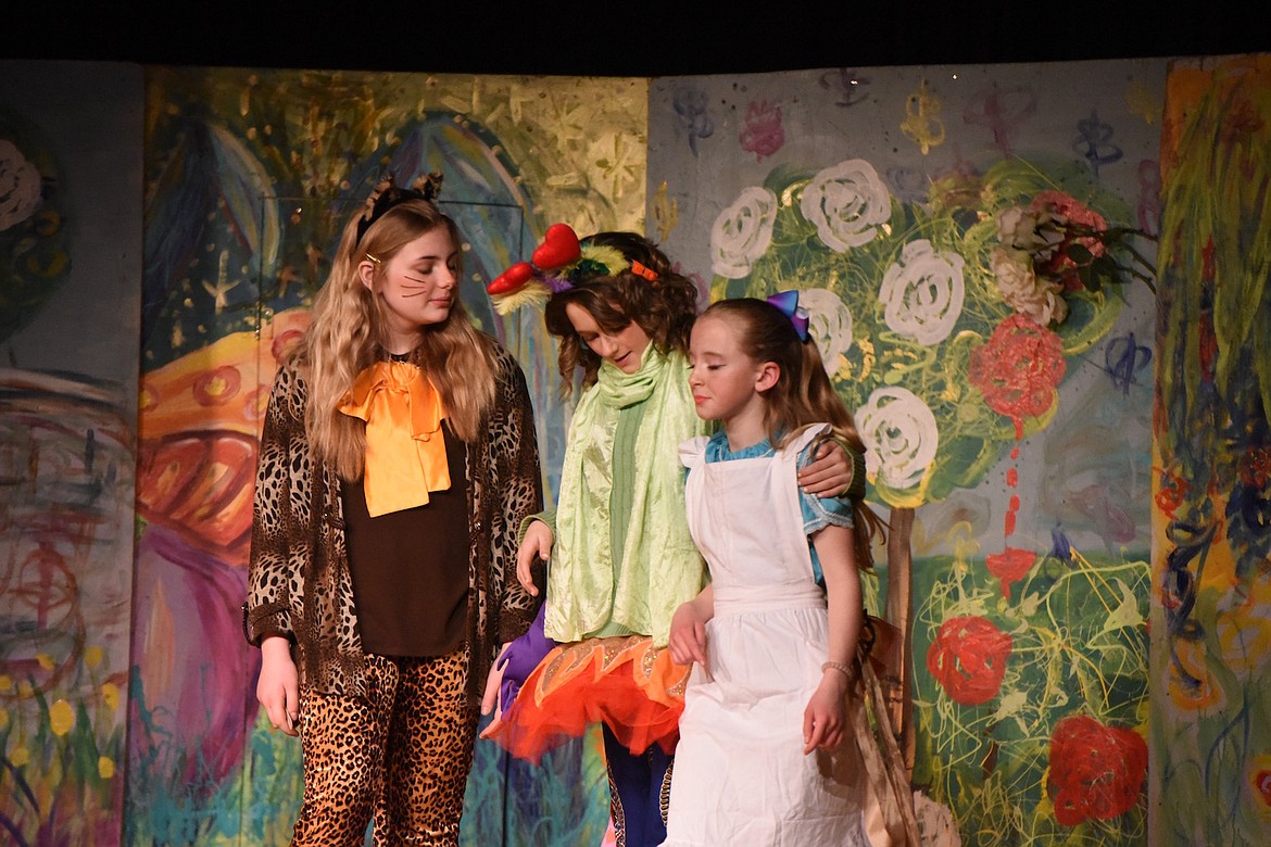 Linzie Willis as the Cheshire Cat, Brynn DeShazer as the Caterpillar and Margaret Smith-Salter as Alice at the Pitiful Players rendition of 'Alice in Wonderland' at the Maki Theatre on Saturday, March 11. (Scott Shindledecker/The Western News)