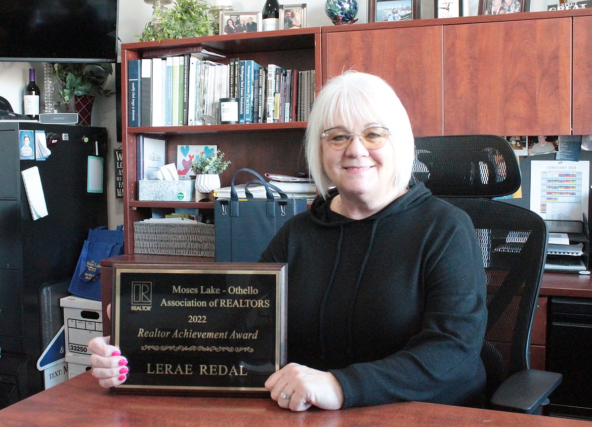 LeRae Redal shows her Achievement Award from the Moses Lake-Othello Realtors Association. She’s won the award a couple of times before, she said, but this year came as a surprise to her.