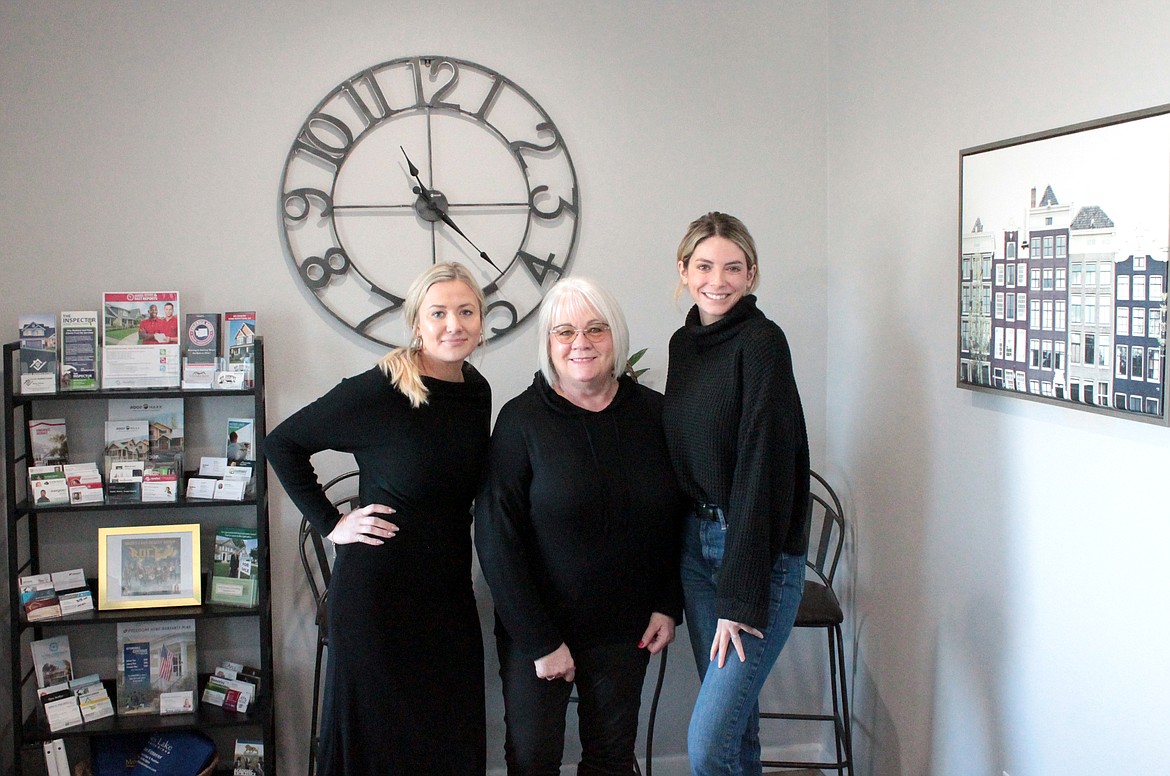 LeRae Redal poses with Moses Lake Realty Group brokers Anna Van Diest, left, and Heidi Van Diest at the MLRG office on Broadway Avenue.