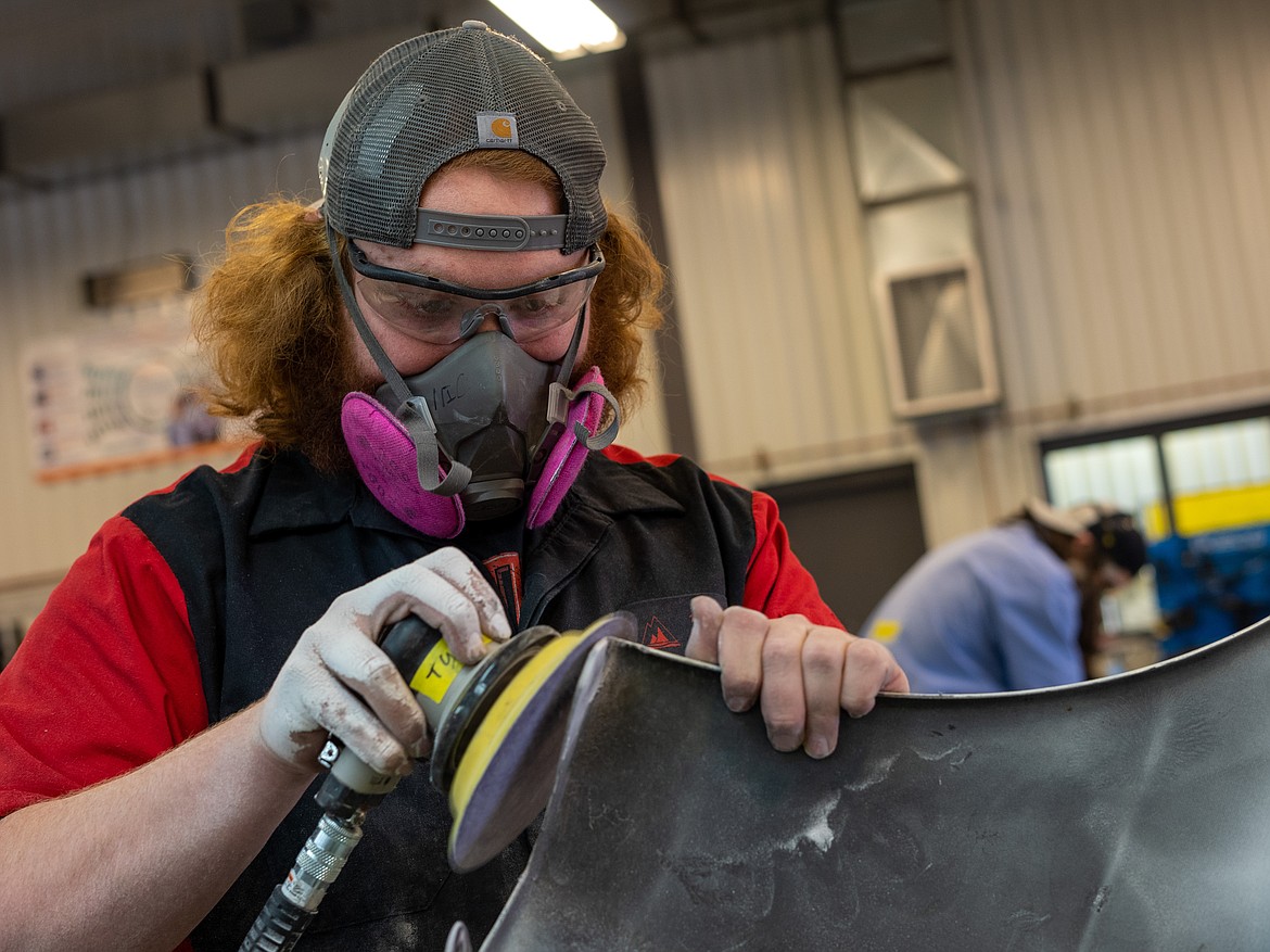 NIC student Tyler Brown works on his autobody repair entry in North Idaho College’s auto collision repair competition Friday, March 10 at NIC’s Parker Technical Education Center in Rathdrum.
