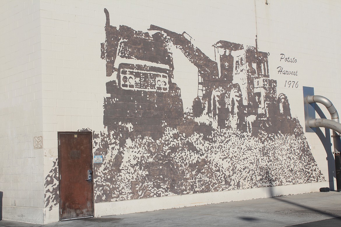 A mural depicting the old-school method of harvesting potatoes can be found on the side of the Lamb-Weston facility in Quincy. In this case “old school” is the mid-1970s.