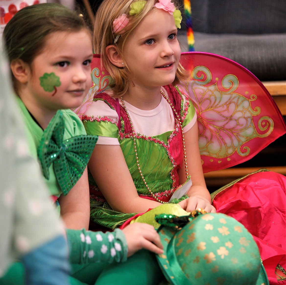 Lola Rayner and Lily Rush join classmates at Kinder Magic in celebrating St. Patrick's Day on Thursday.